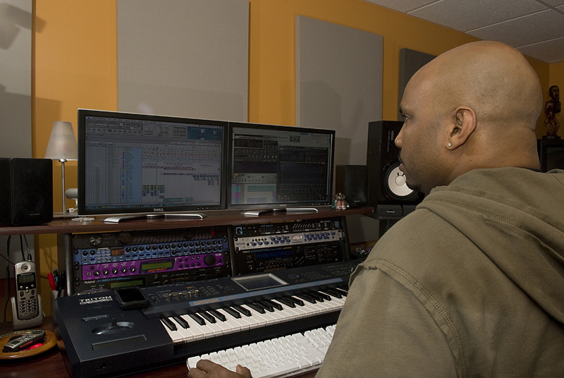 Malik on the controls in his home studio. Photo by Marcus C. Eddings, MCE Photography